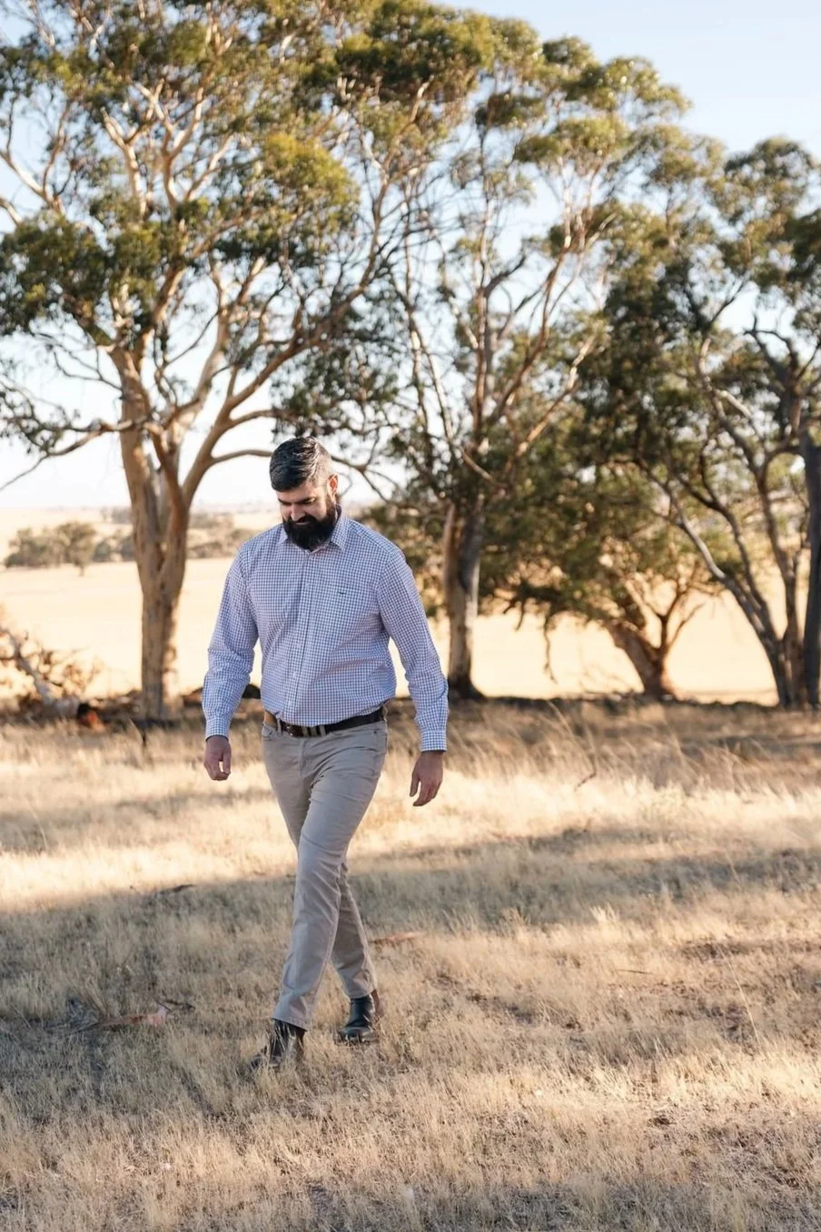 Byfields adviser walking through a paddock