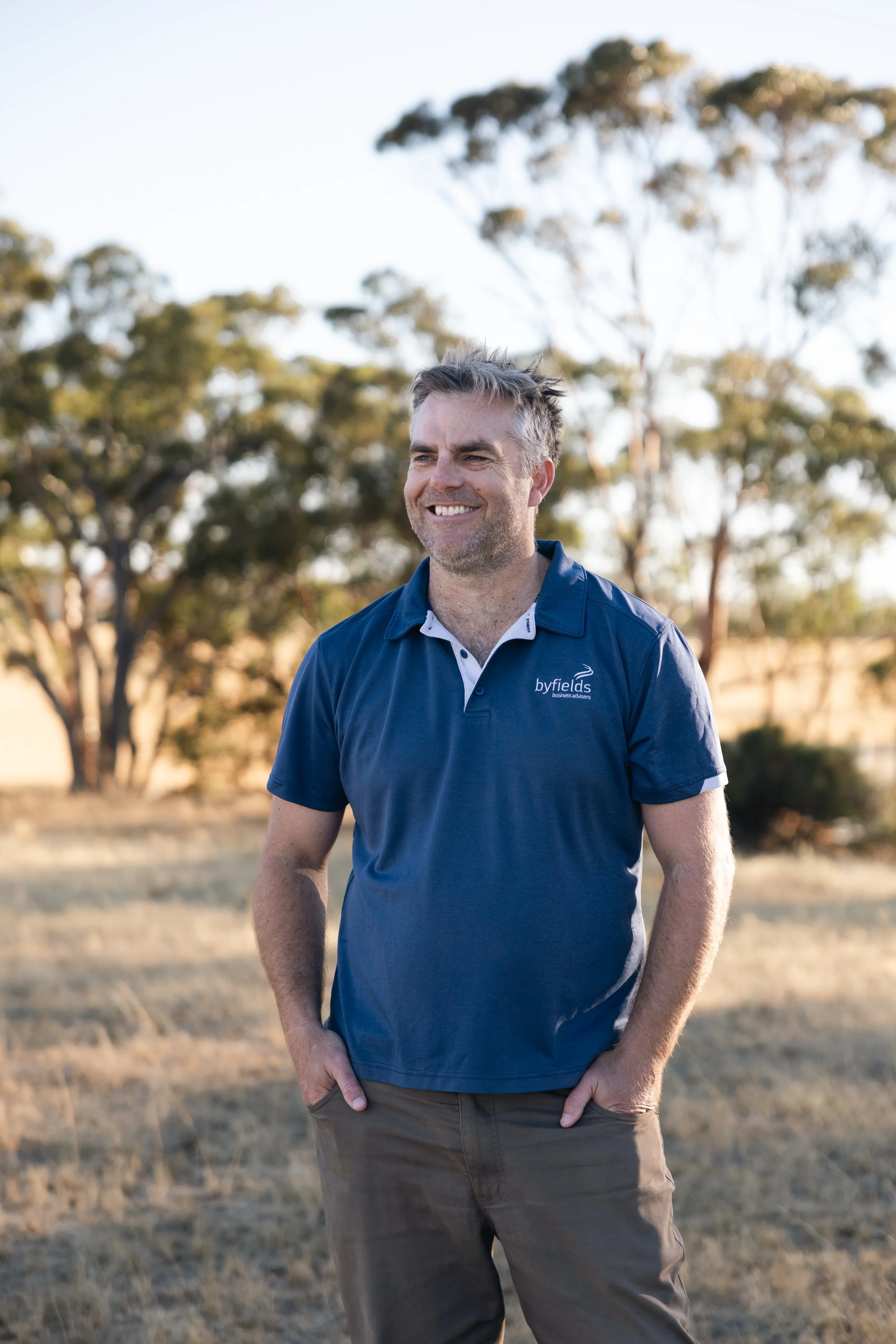 Byfields adviser standing in a paddock in regional WA