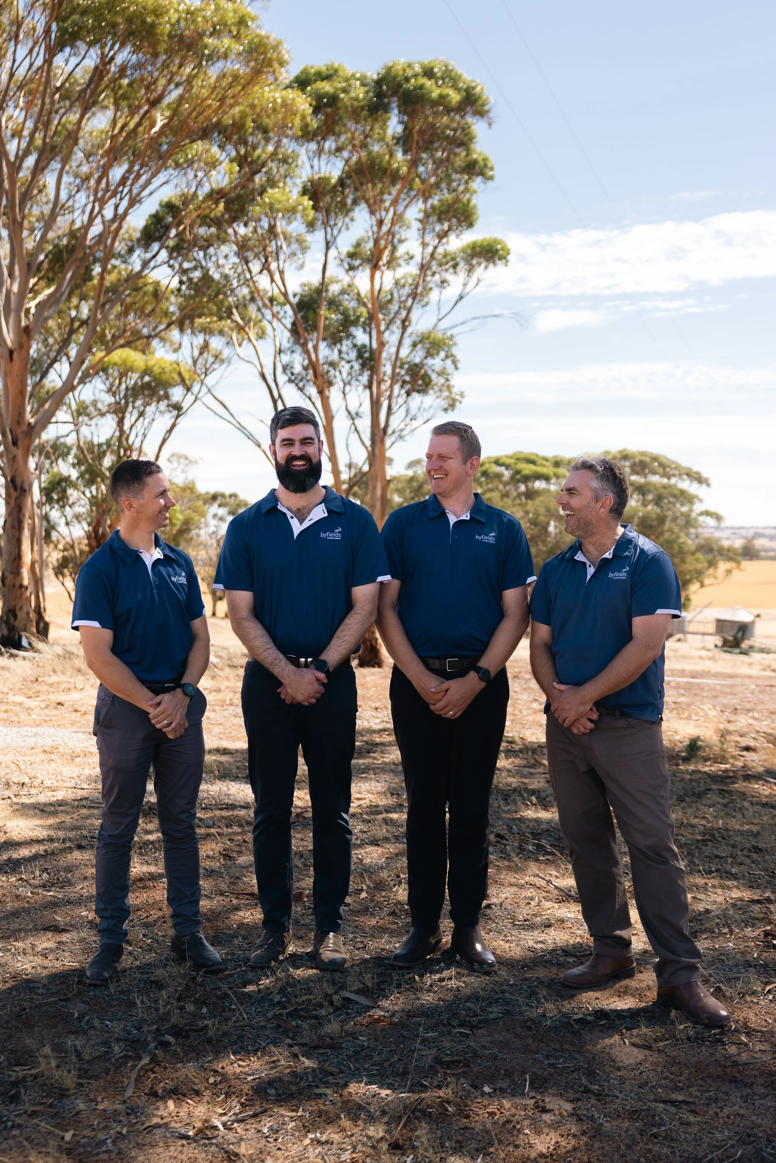 Four Byfields advisers standing together in a paddock