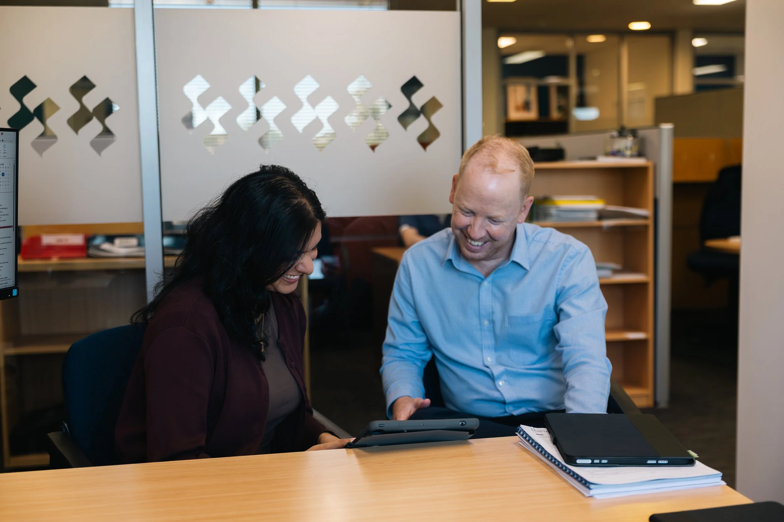 Byfields adviser meeting with a client in the office