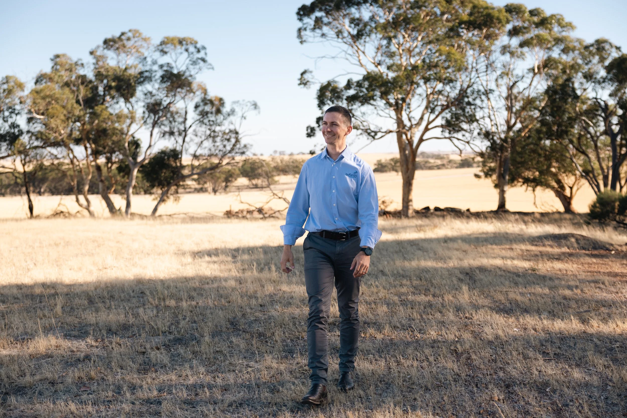 Byfields team member standing in a paddock in regional WA