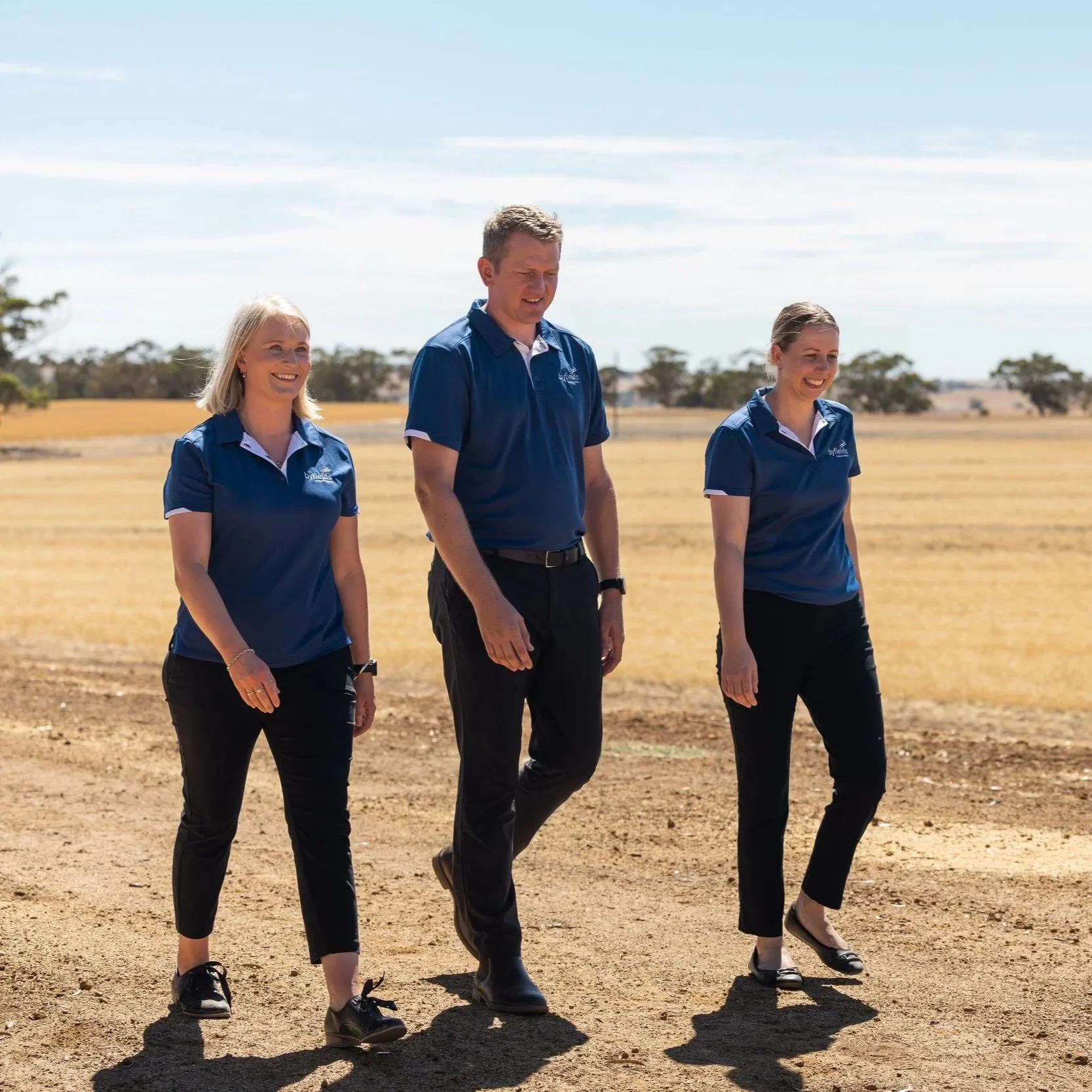 Three Byfields advisers walking through a paddock