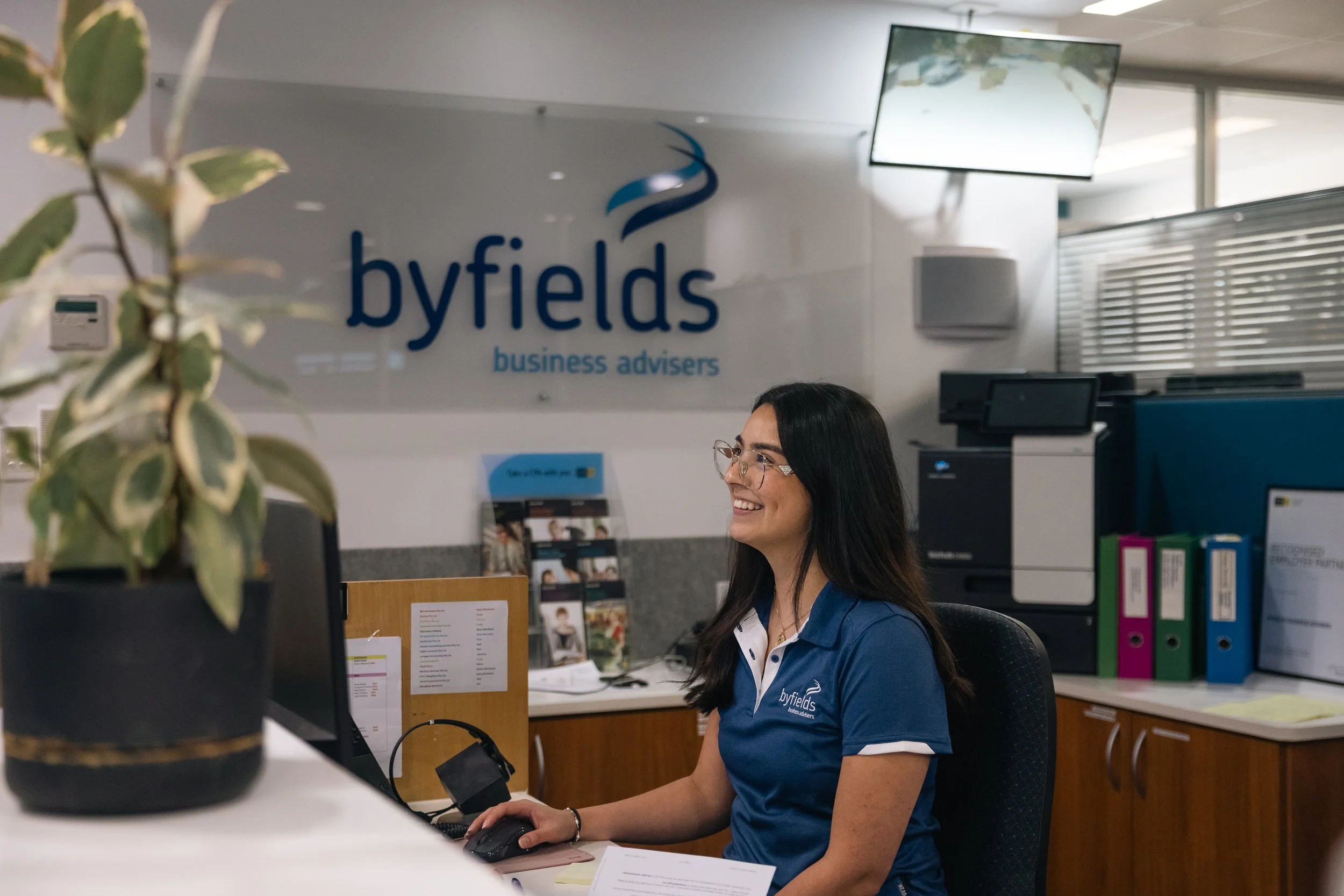 Byfields team member at the front desk of a regional office