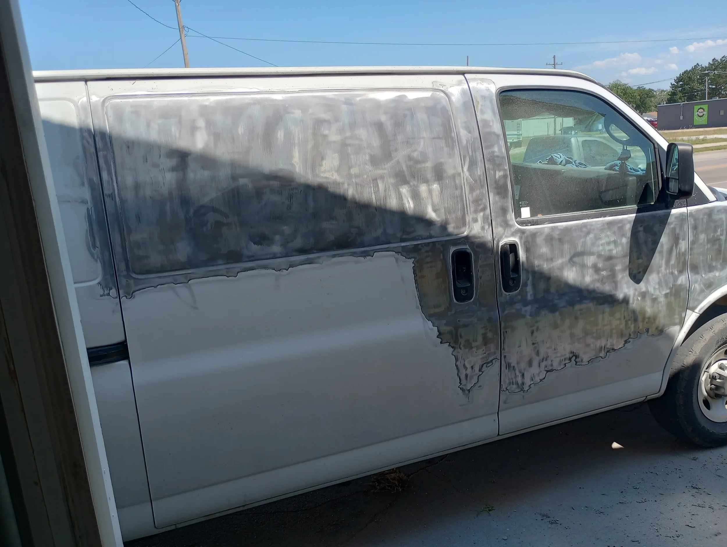 work van 3 stripping old paint.webp