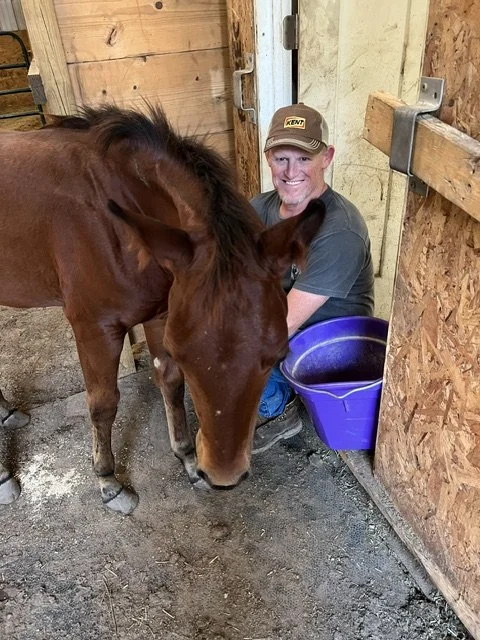 Brian Walker tending to his horses