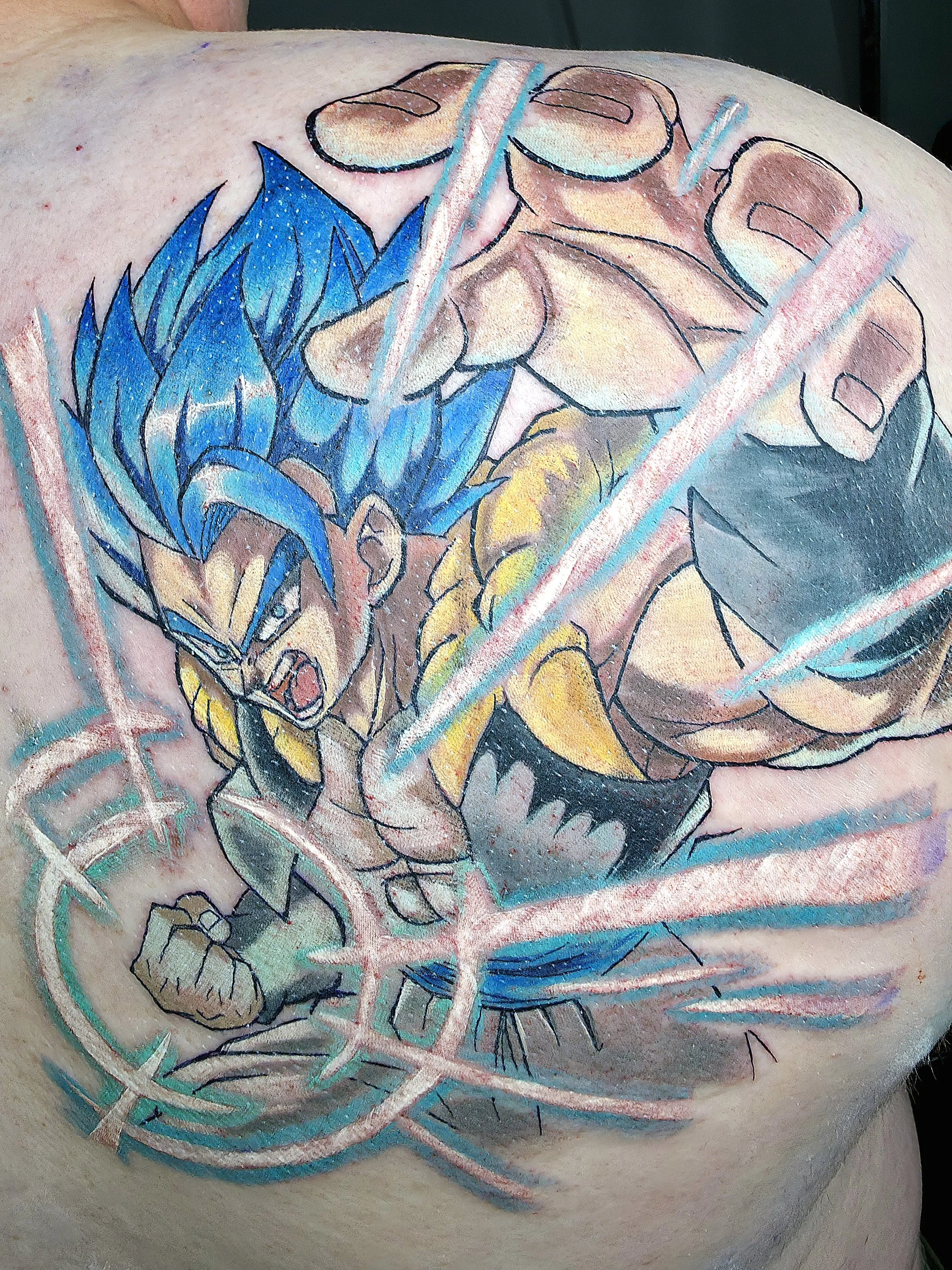 A tattoo of a snake intertwined with a geometric pattern, featuring bold black outlines, vivid blue, yellow, and beige colors, on skin.