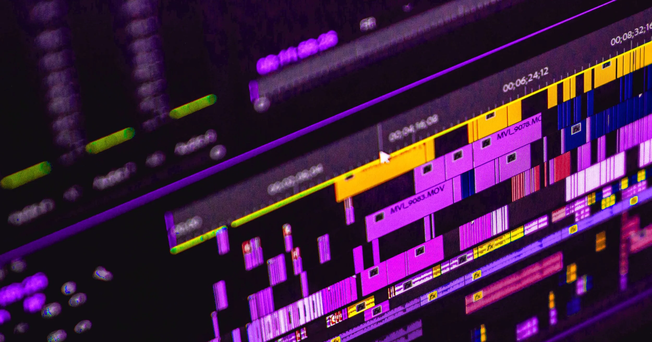 A computer screen displaying a digital audio editing software with colorful tracks, waveforms, and timeline markings.