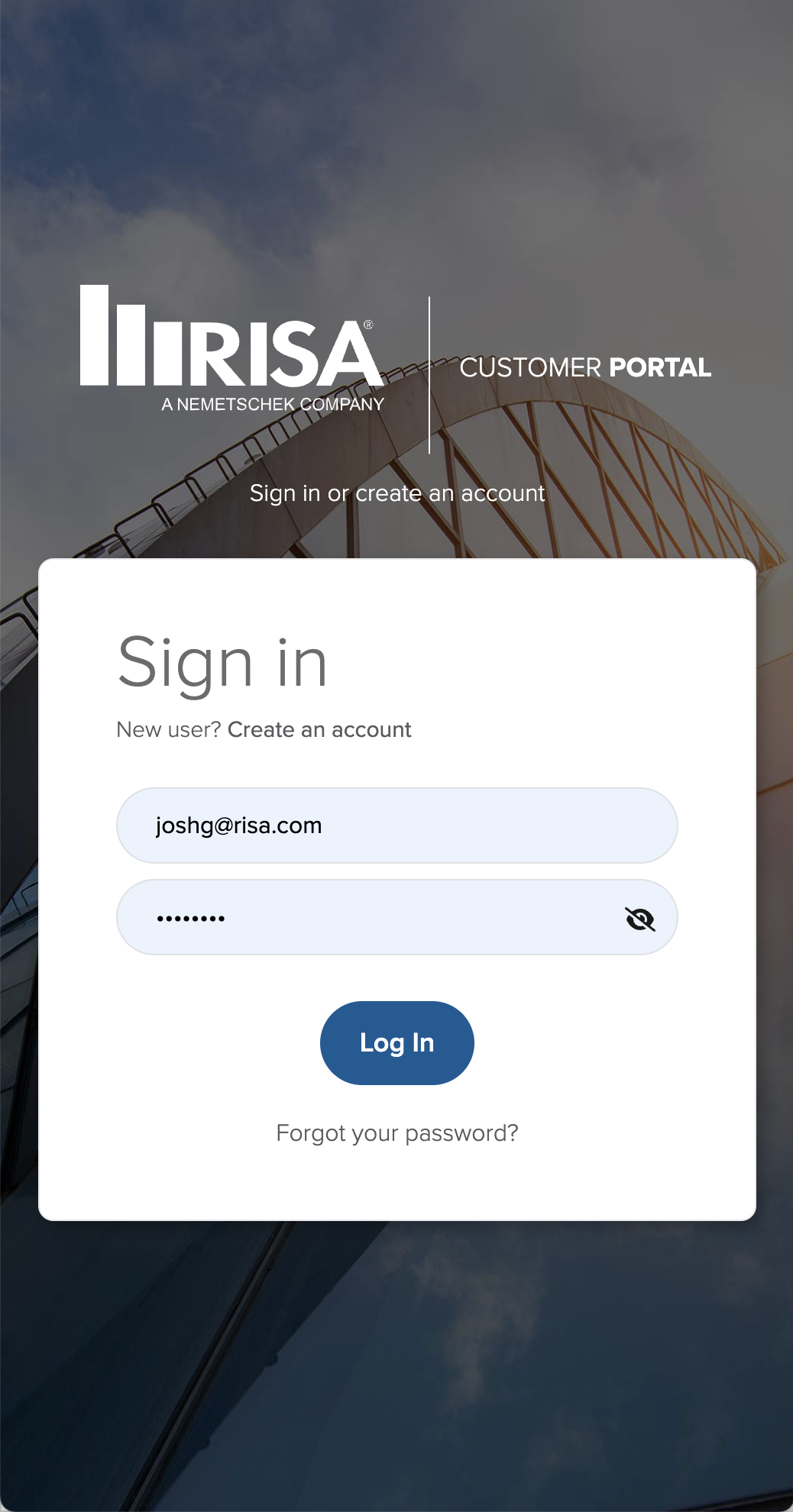 Login screen for IRISA customer portal with background image of a modern building. Fields for email and password, login button, and options to create an account or reset password.