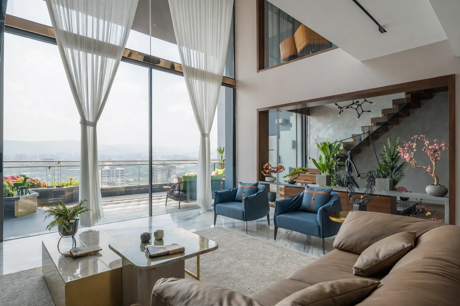 Modern living room with large floor-to-ceiling windows, white curtains, blue armchairs, a beige sofa, a marble coffee table, and decorative plants.