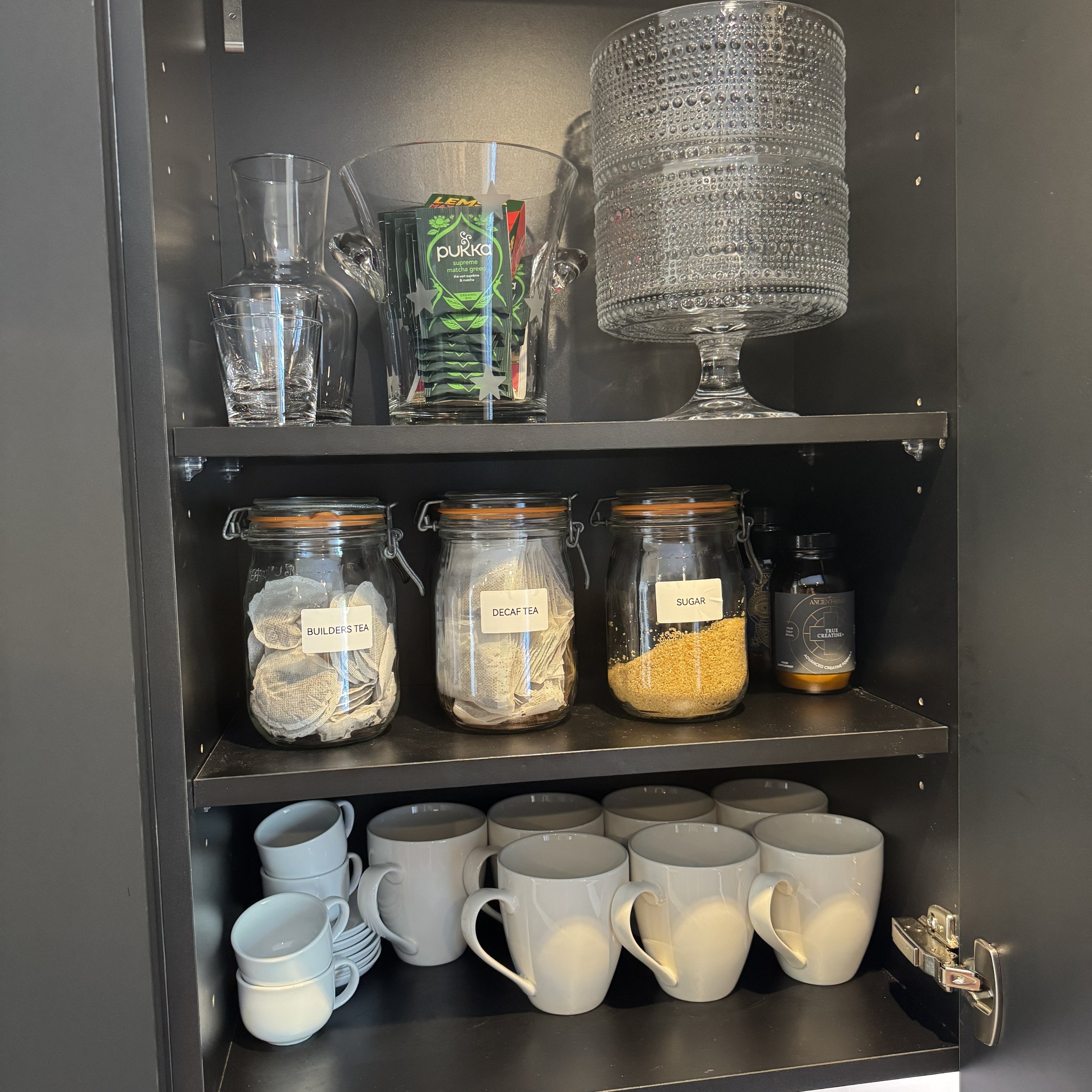 Tea and mug station with labelled storage jars