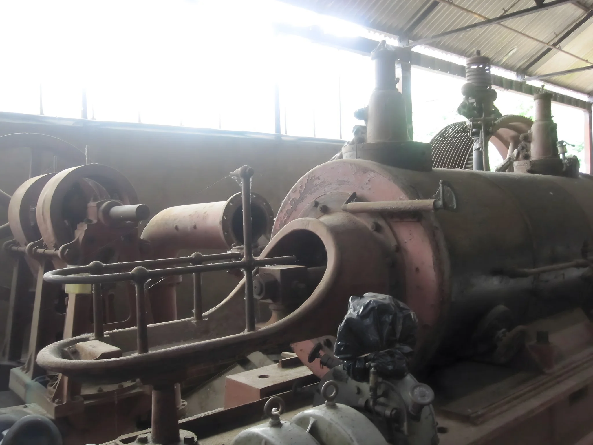 Iron cylinder with protruding element at Leeds Industrial Museum, Armley Mills — derelict steam engine machinery