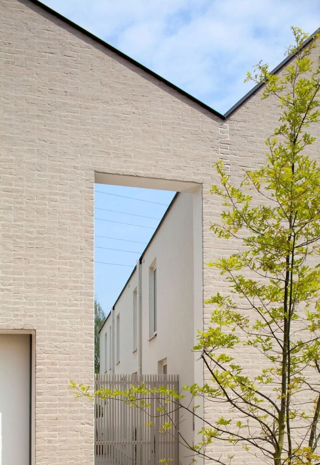 Residential courtyard development in Flanders, Belgium, creating attractive new homes through innovative urban design and housing-led placemaking - Edge Architecture