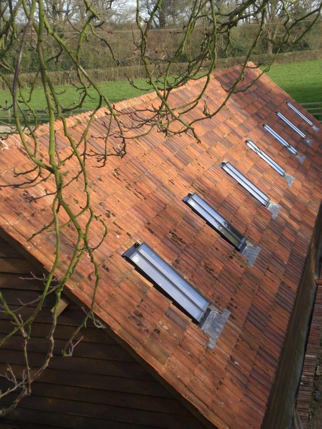 Historic barn conversion in Berkshire, adapting a Grade II listed curtilage building for contemporary residential and office use while preserving its character - Edge Architecture