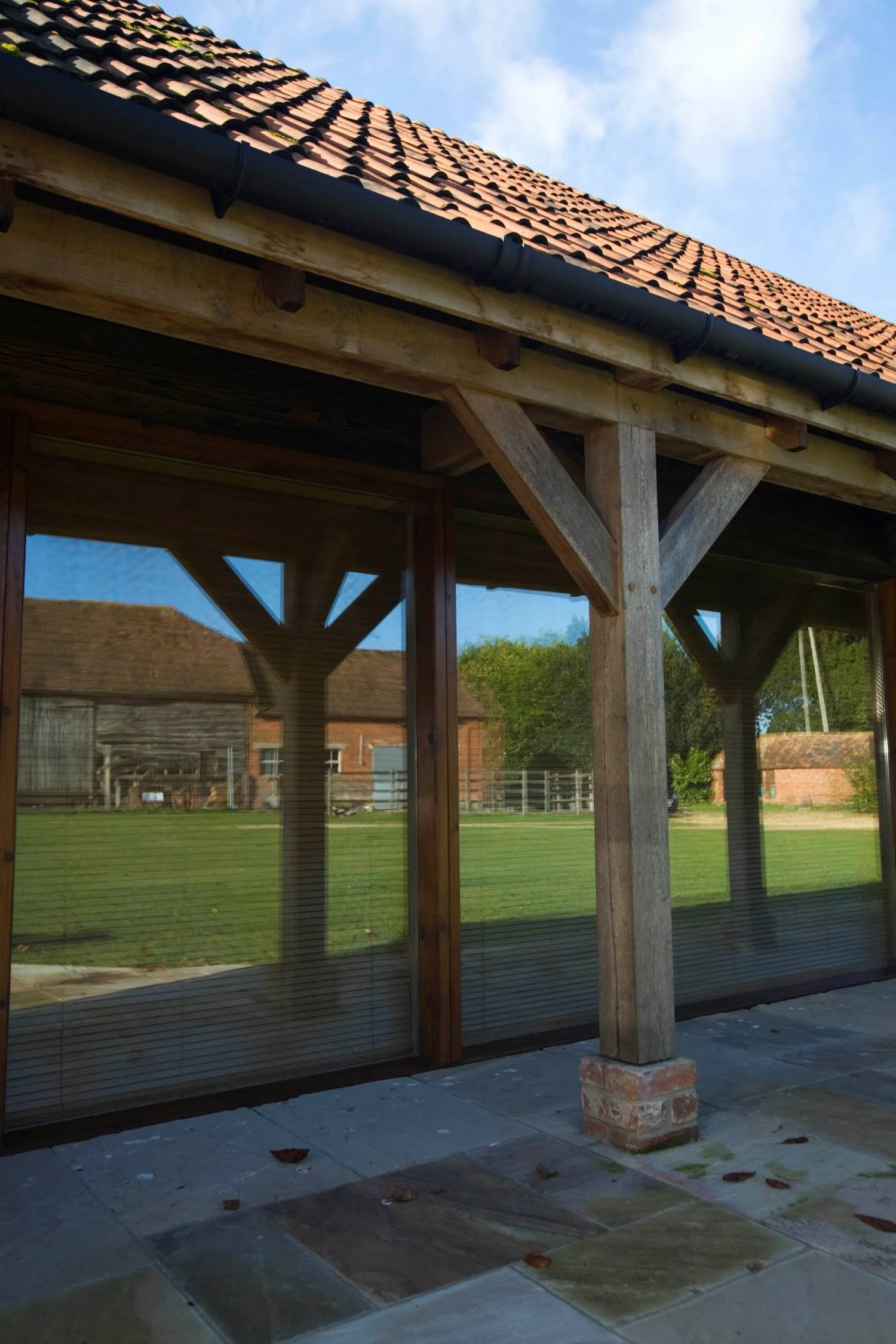 Historic barn conversion in Berkshire, adapting a Grade II listed curtilage building for contemporary residential and office use while preserving its character - Edge Architecture