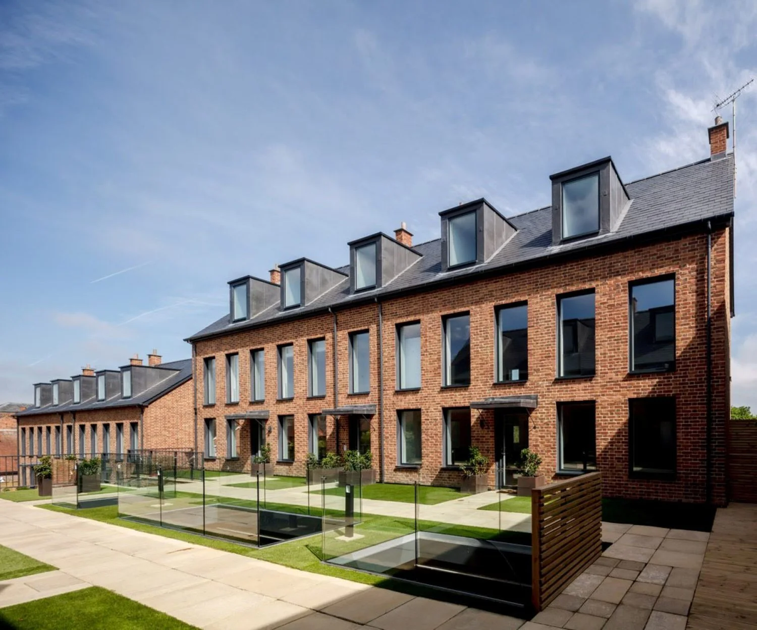 Infill development in Hungerford, Berkshire, delivering three townhouses and ten apartments within a conservation area, combining contemporary architecture with a sensitive historic setting - Edge Architecture