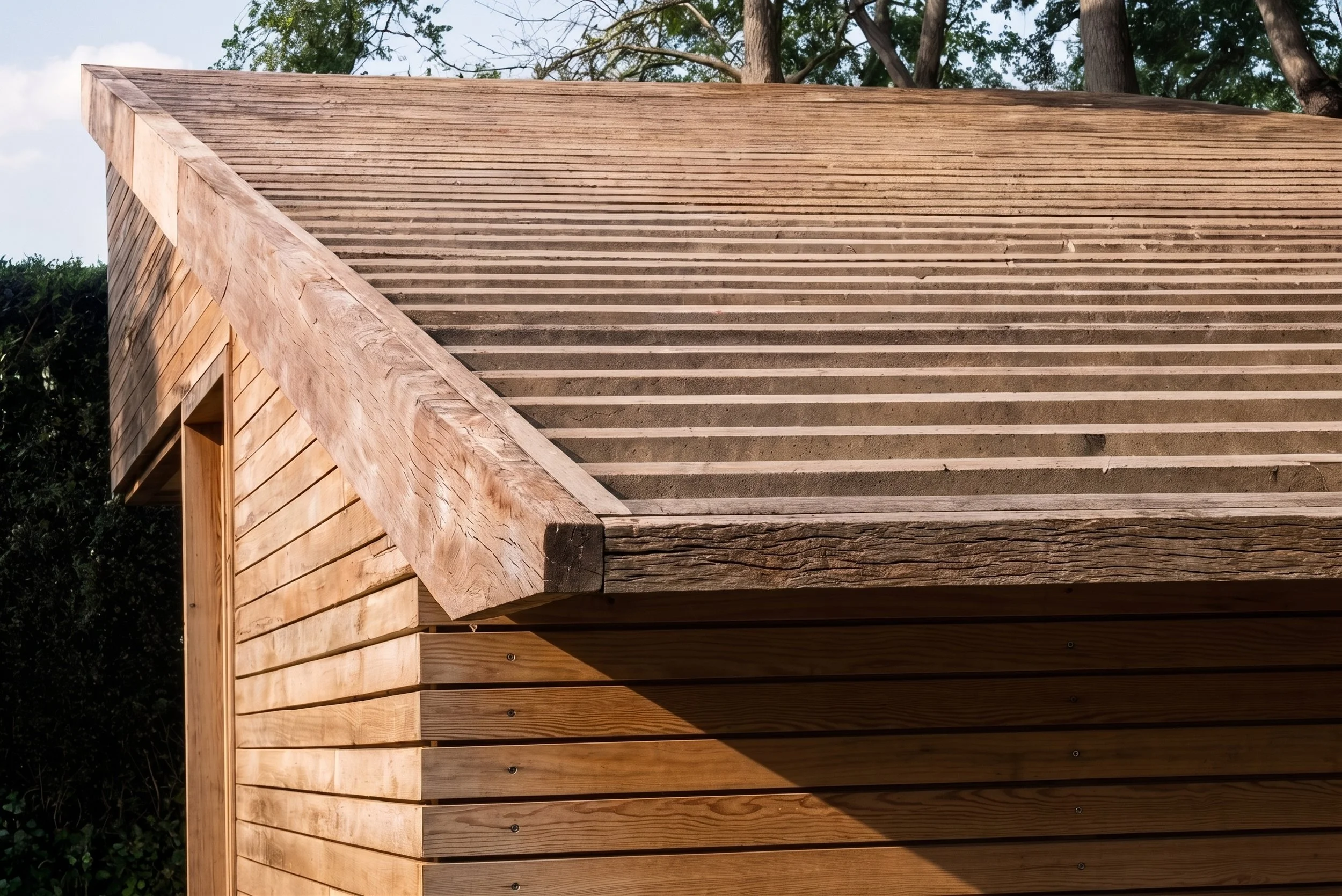 A garden shed combining practical storage and a tranquil garden room, with views of the pond, allotments and canal, beneath a trellis roof intended to support future climbing plants- Edge Architecture