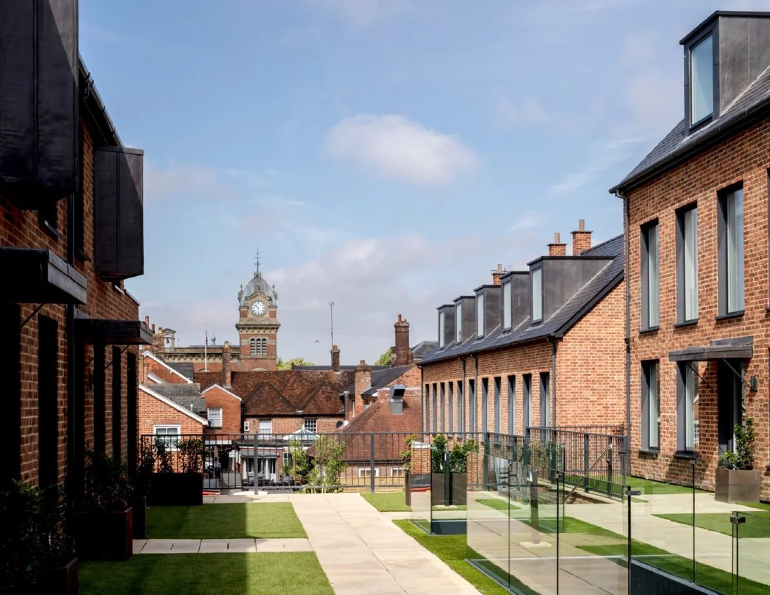 Infill development in Hungerford, Berkshire, delivering three townhouses and ten apartments within a conservation area, combining contemporary architecture with a sensitive historic setting - Edge Architecture
