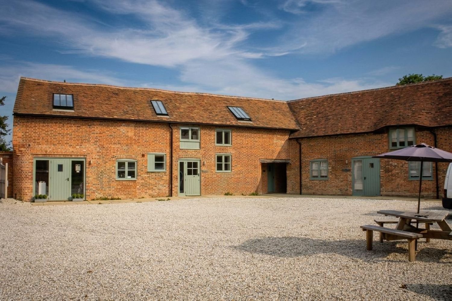 Conversion of Grade II listed stables in Hampstead Norreys, Berkshire, creating four holiday cottages and a farm shop as part of a rural diversification project - Edge Architecture