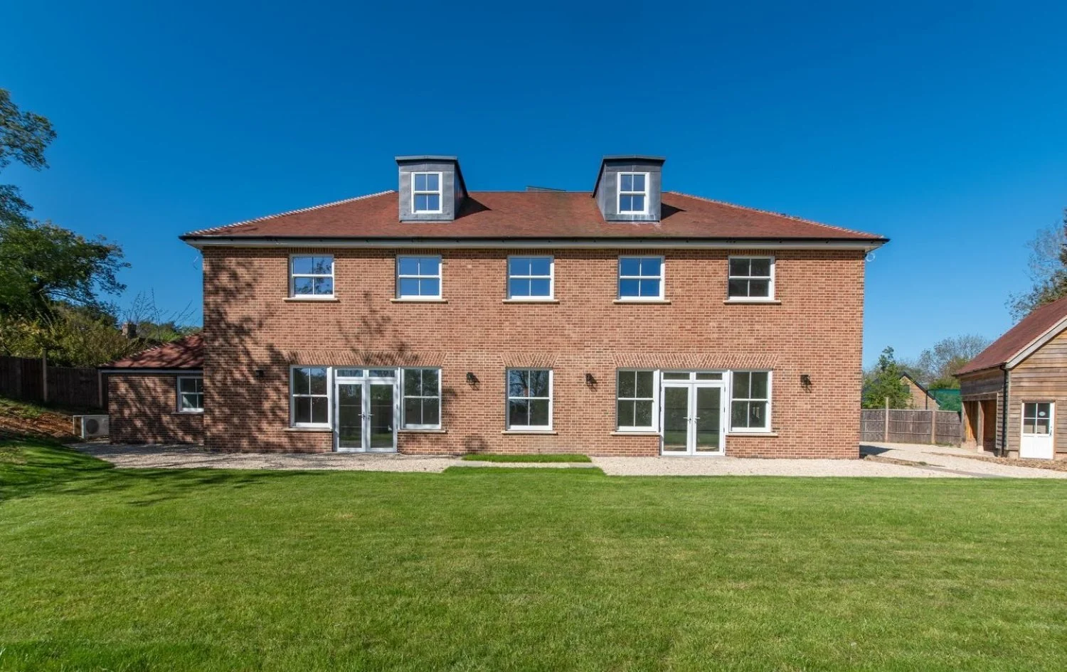 Six-bedroom Georgian-inspired new-build house in Hampshire by Edge Architecture, combining classical architecture with contemporary living 
