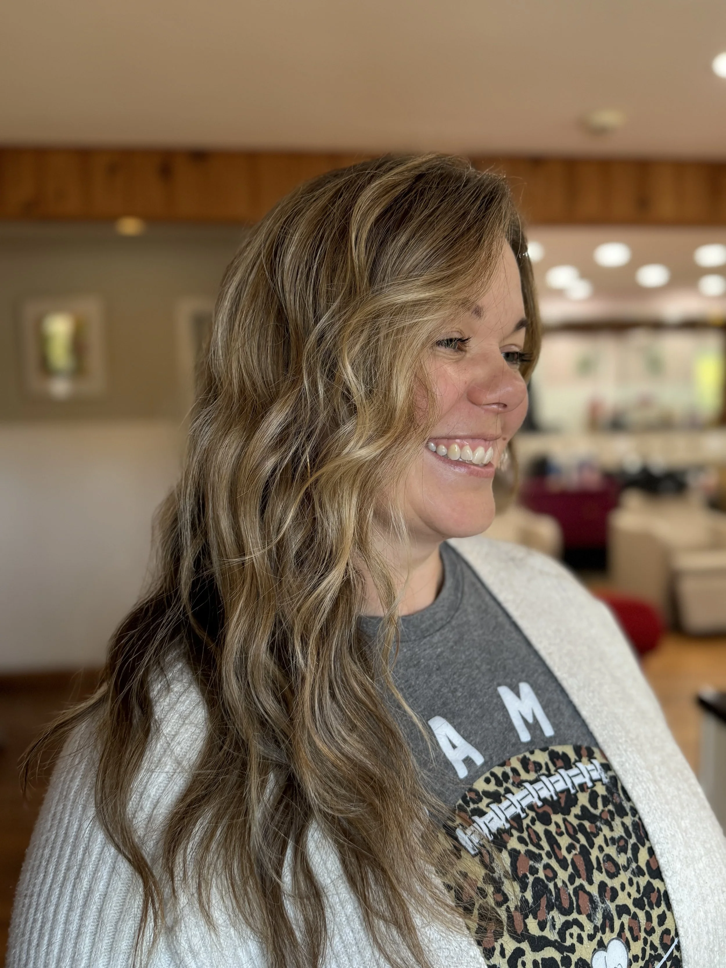 Rich, warm brunette with ribbons of golden blonde highlights.
