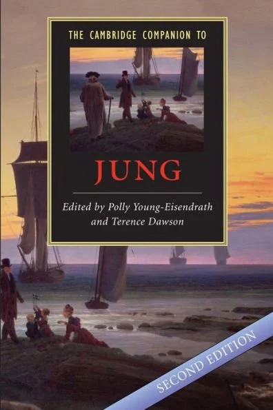 Cover of the book 'The Cambridge Companion to Jung', edited by Polly Young-Eisendrath and Terence Dawson, second edition, featuring a scenic illustration of people on a beach with sailboats, under a sunset sky.