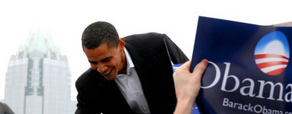 A person holding a campaign sign for Barack Obama with a city skyline in the background. Cover image for Dreams of Totality's excerpt of "He's the One".