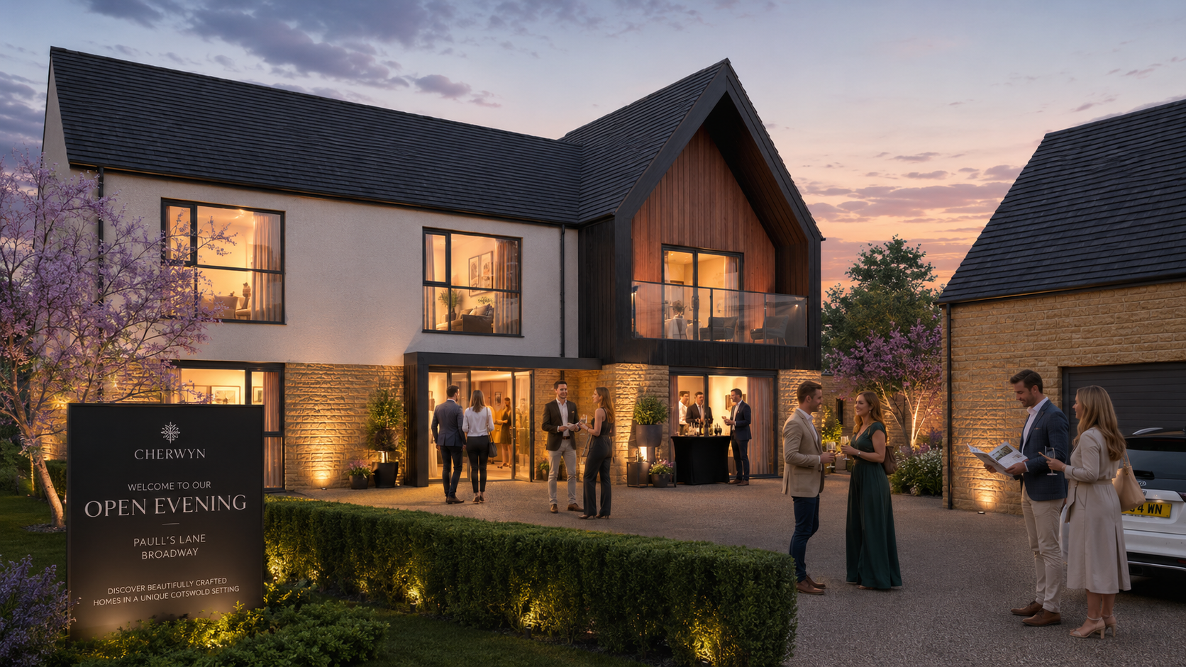 People gathered outside a modern, multi-story house during an open evening event at dusk, with warm interior lighting, flowering trees, and a sign welcoming guests.