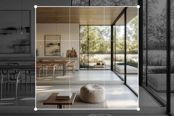 Lexwell-Partners - Modern living room with large glass windows overlooking a garden, minimal furniture, and a neutral color palette.