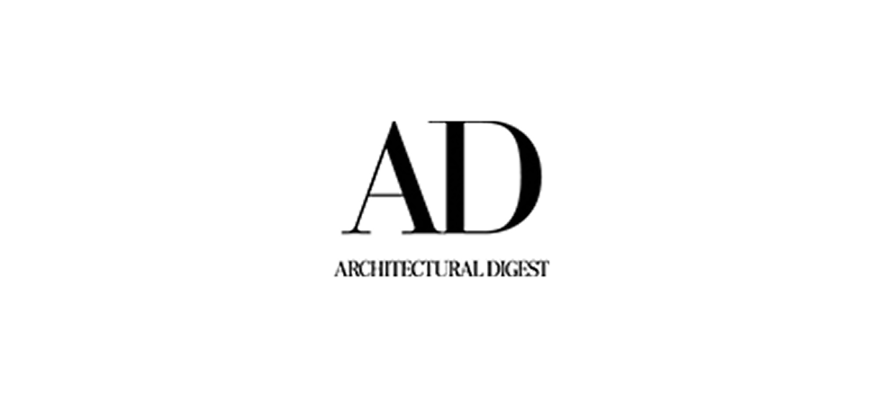 A black and white illustration of a key with a circular handle and a rectangular bit, overlaying a geometric drawing of a hexagon with a star inside.