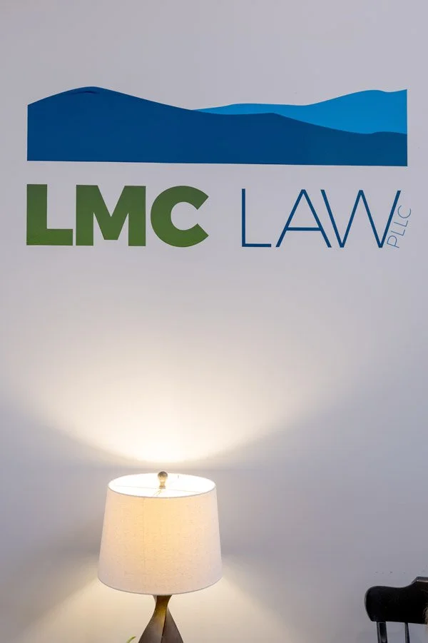 Sign of LMC LAW logo on the wall
