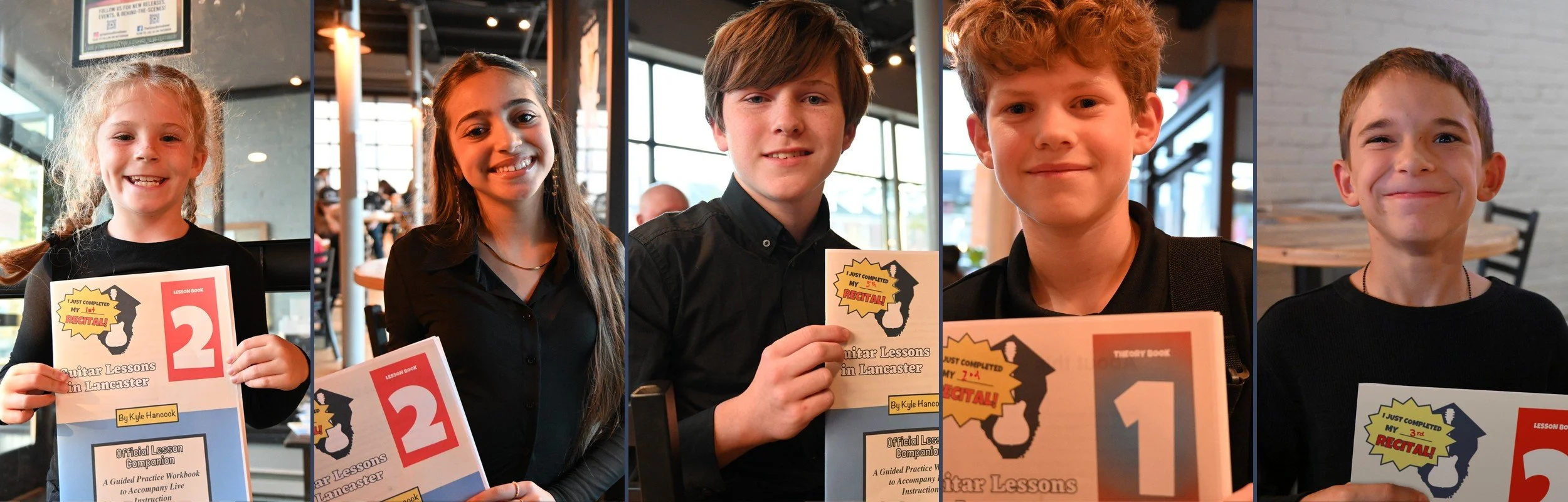 Smiling guitar students holding their Lesson Companion books at the Lancaster Guitar Showcase