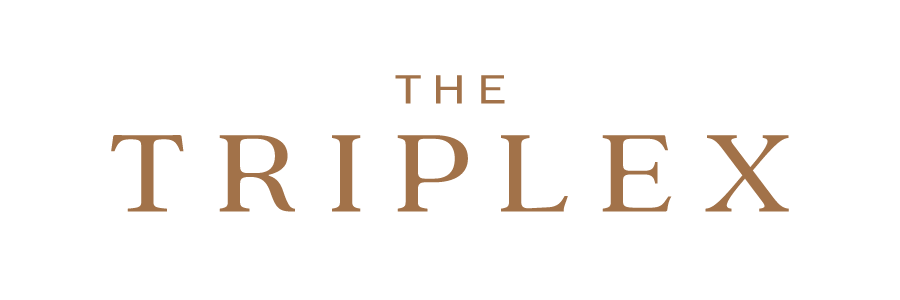 Logo for the 'The Triplex' with the title in bronze.