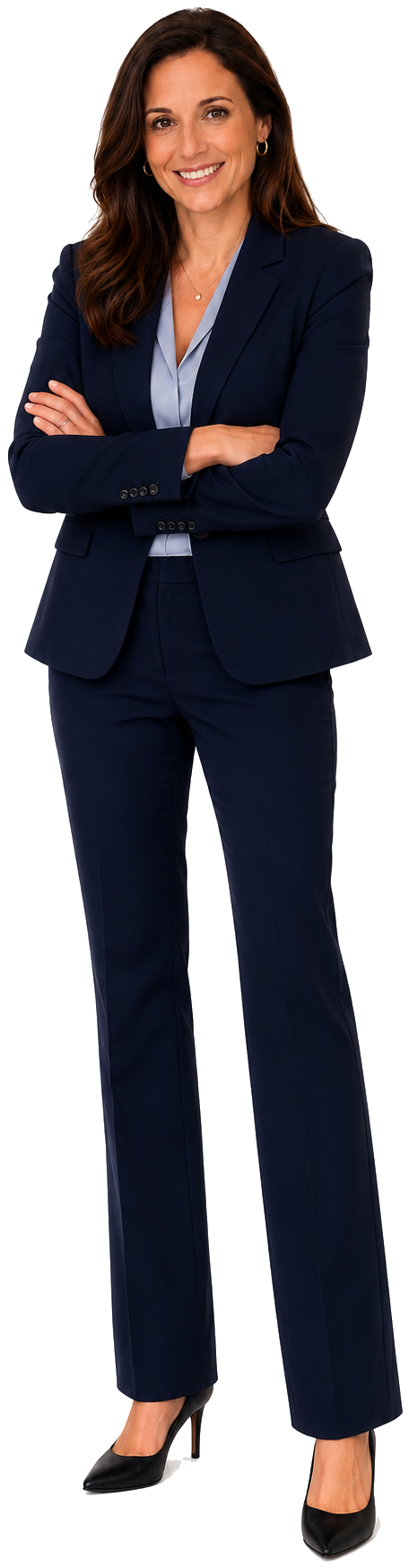A professional woman with long brown hair in a navy blue business suit, standing with arms crossed and smiling, wearing black heels.