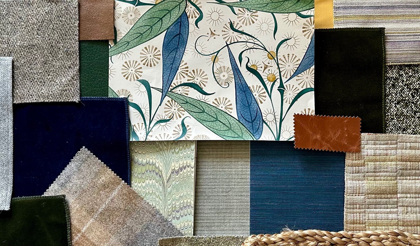 A collection of fabric swatches in various colors, patterns, and textures, including floral, striped, solid, and tweed designs.
