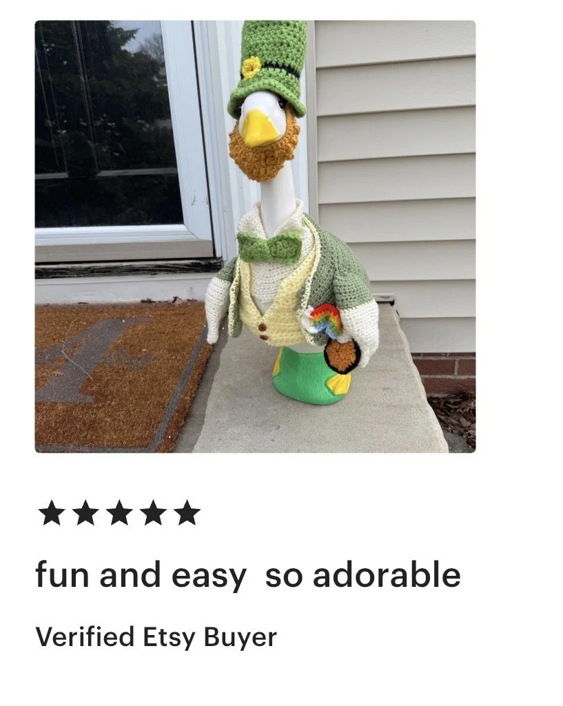 A decorative gnome figurine dressed as a dapper man with a green hat, vest, and bow tie, resembling a duck, placed on a porch step near a window and outside siding.