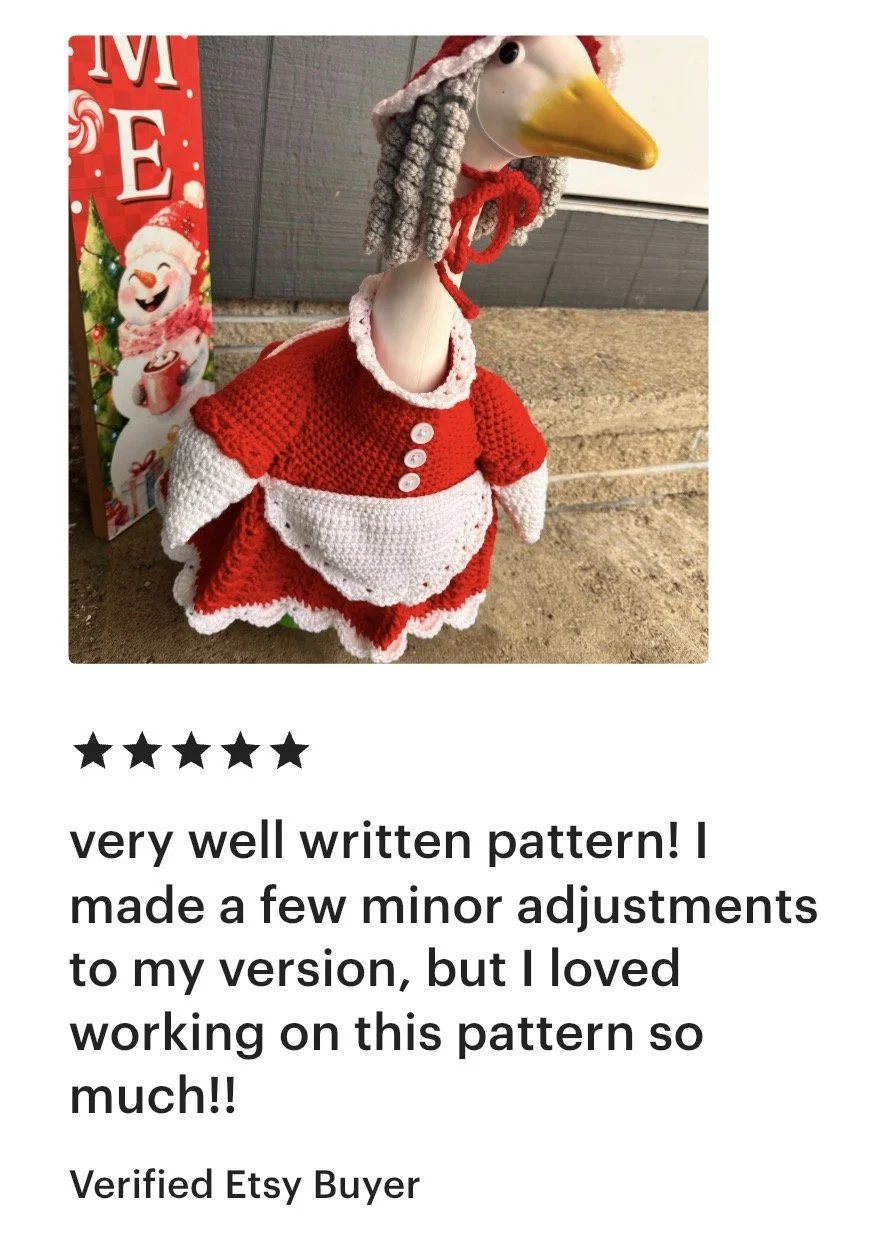A handmade crochet Santa-style snowman with a yellow beak, dressed in a red and white outfit, and a Santa hat. Followed by a Christmas gift bag with holiday designs.