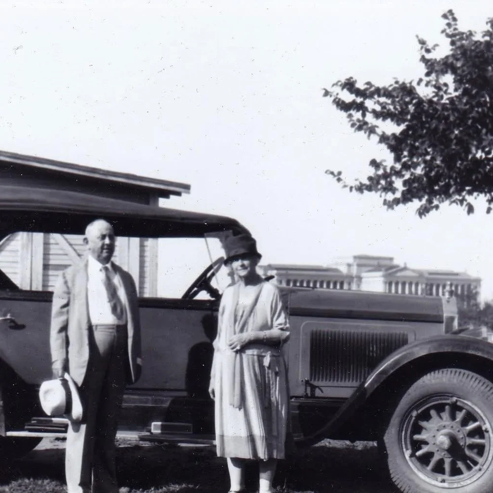 William and Alice Harn standing beside an automobile