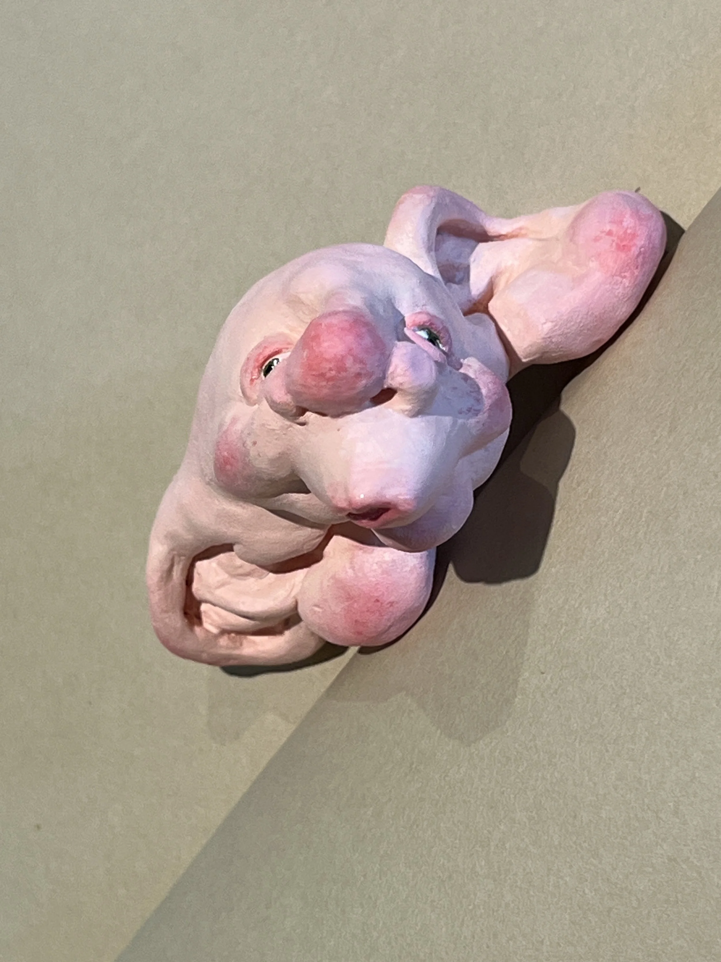 Twisty Head, ~2" long-polymer clay and acrylic paint with gloss mod podge on the lips and eyes