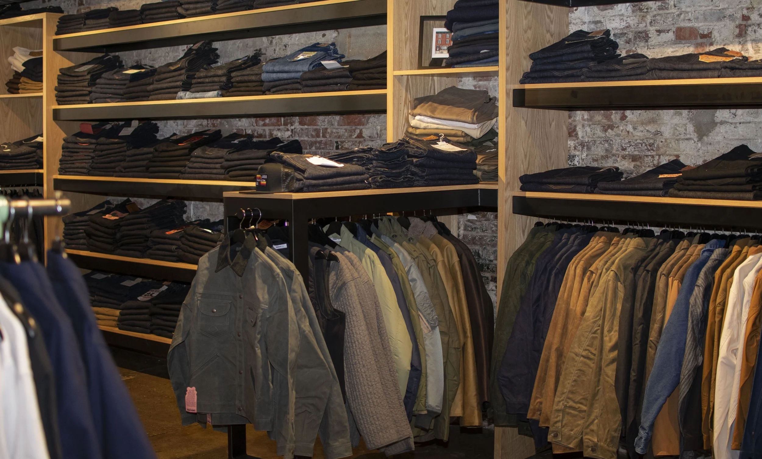 Steel and wood wall display for denim and jackets