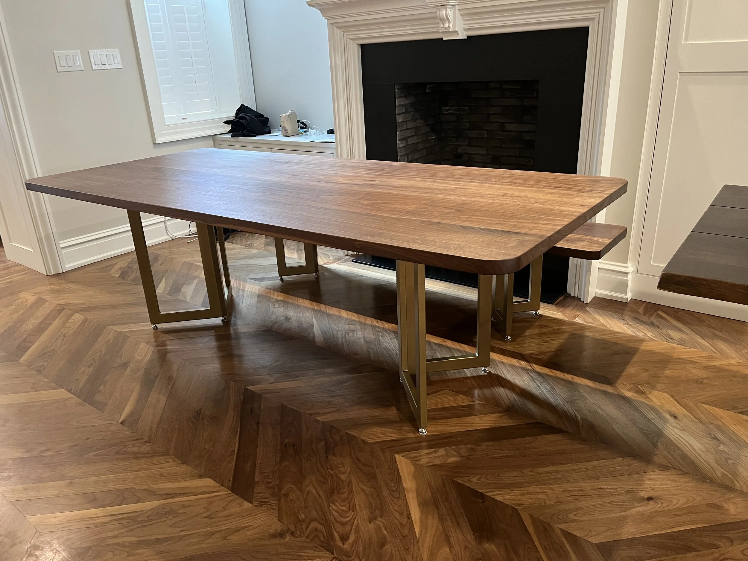 Walnut & powder coated steel table base with matching bench for a Center City Residence