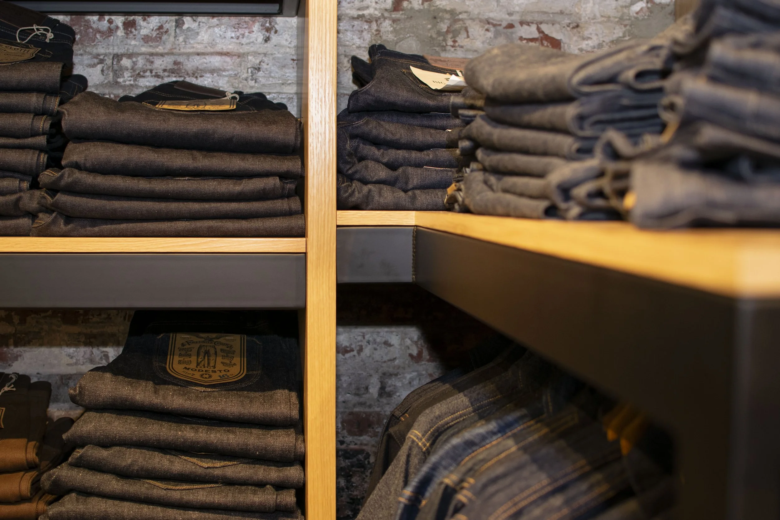 Steel and wood wall display for denim