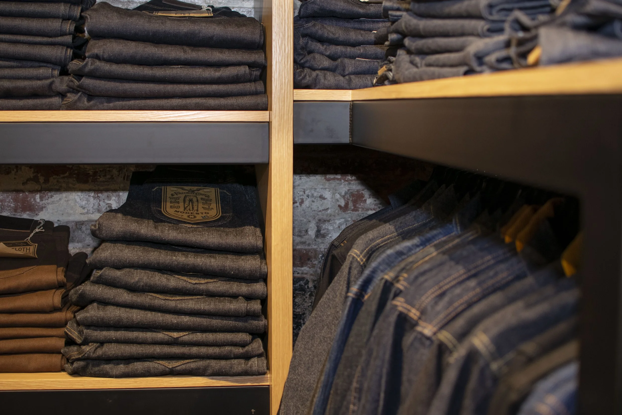 Detail view of steel and wood denim display
