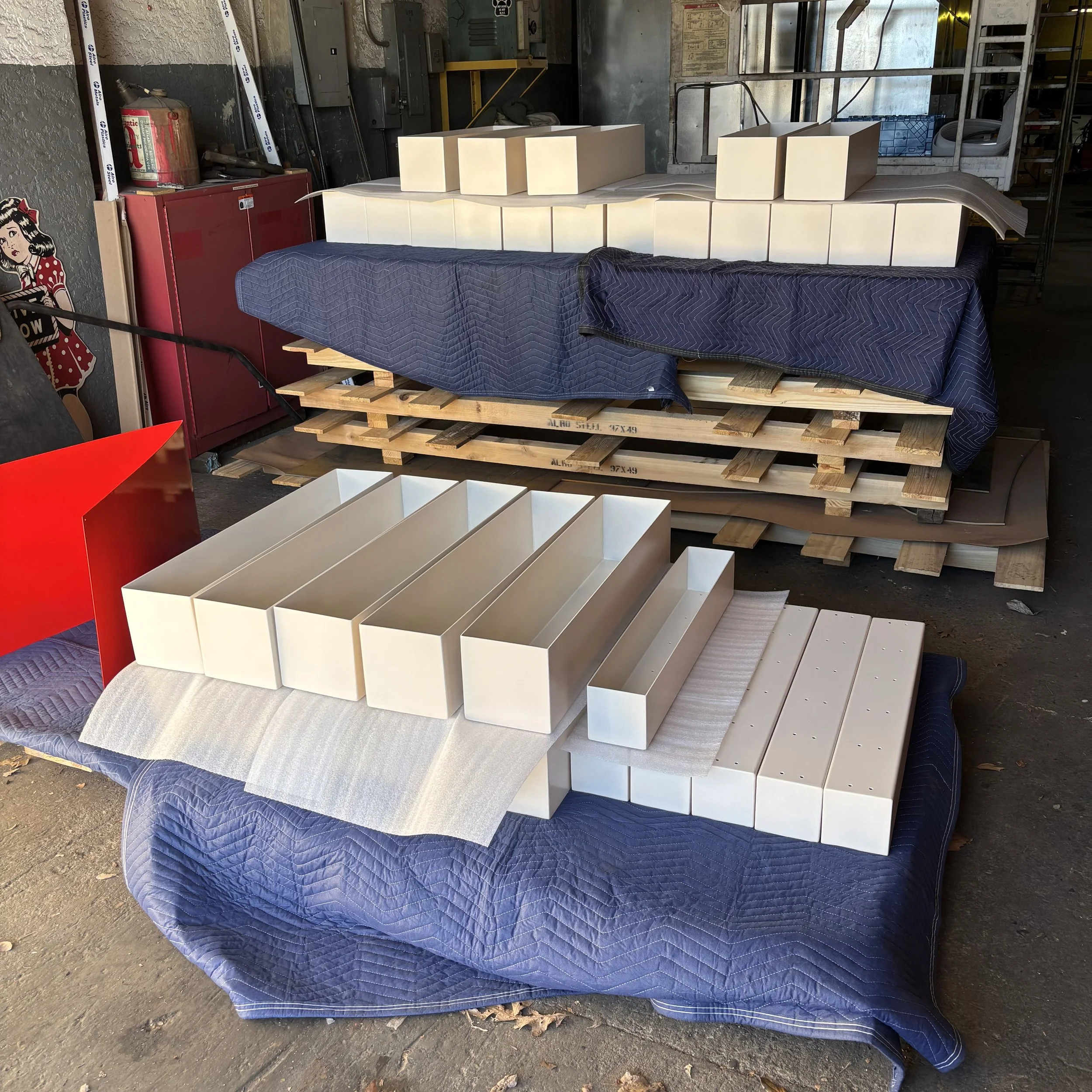 Planter boxes with a cream white powder coat finish.
