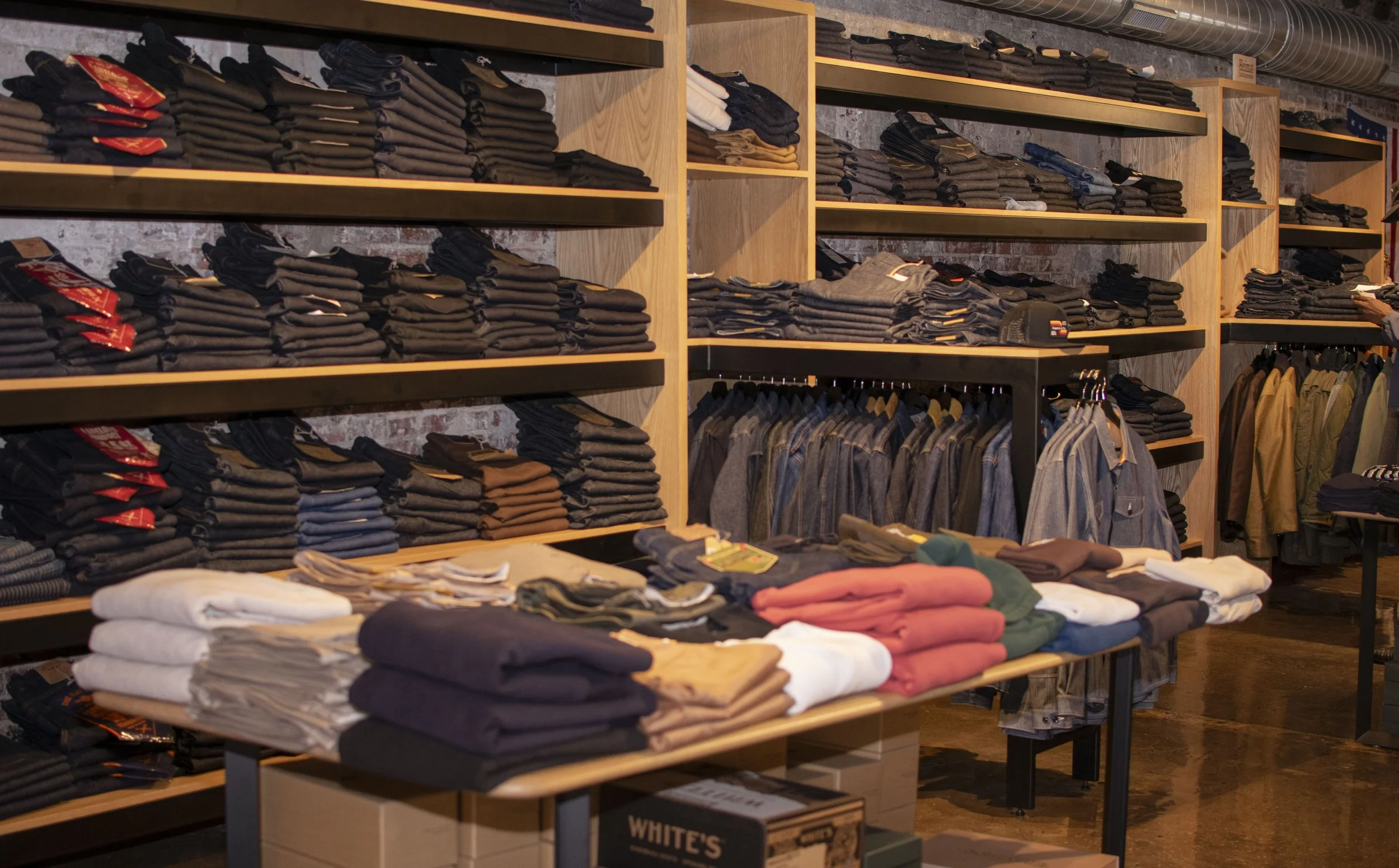 Steel and wood wall display for denim and jackets