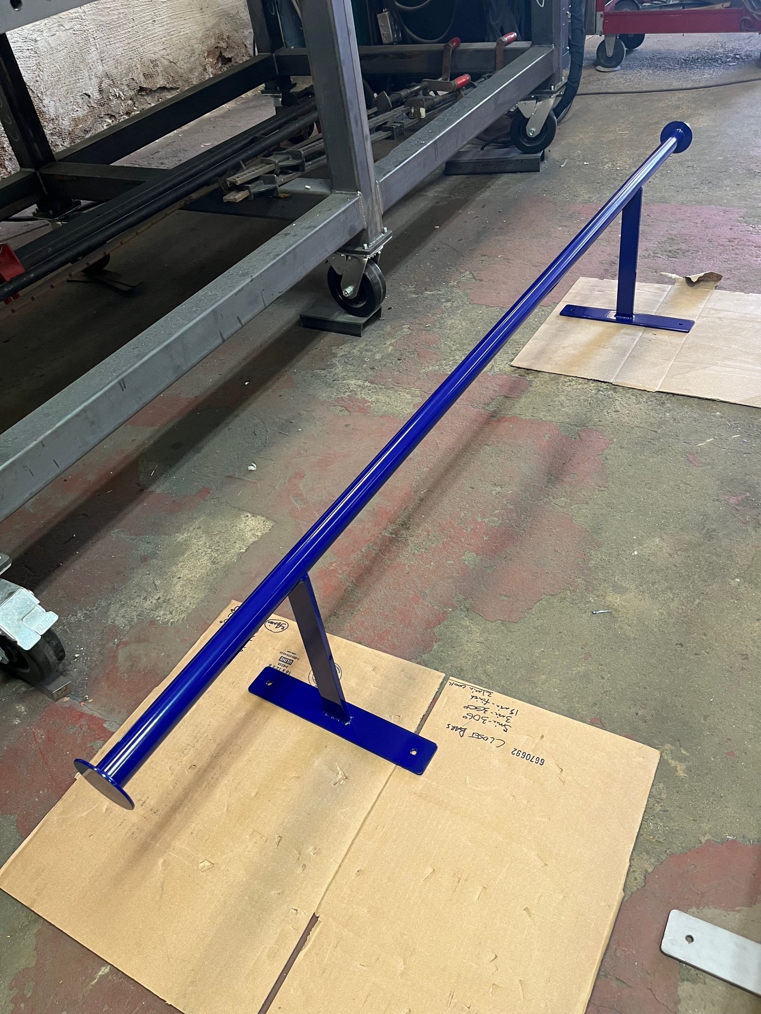 Royal blue steel t-shirt bar for walk in closet