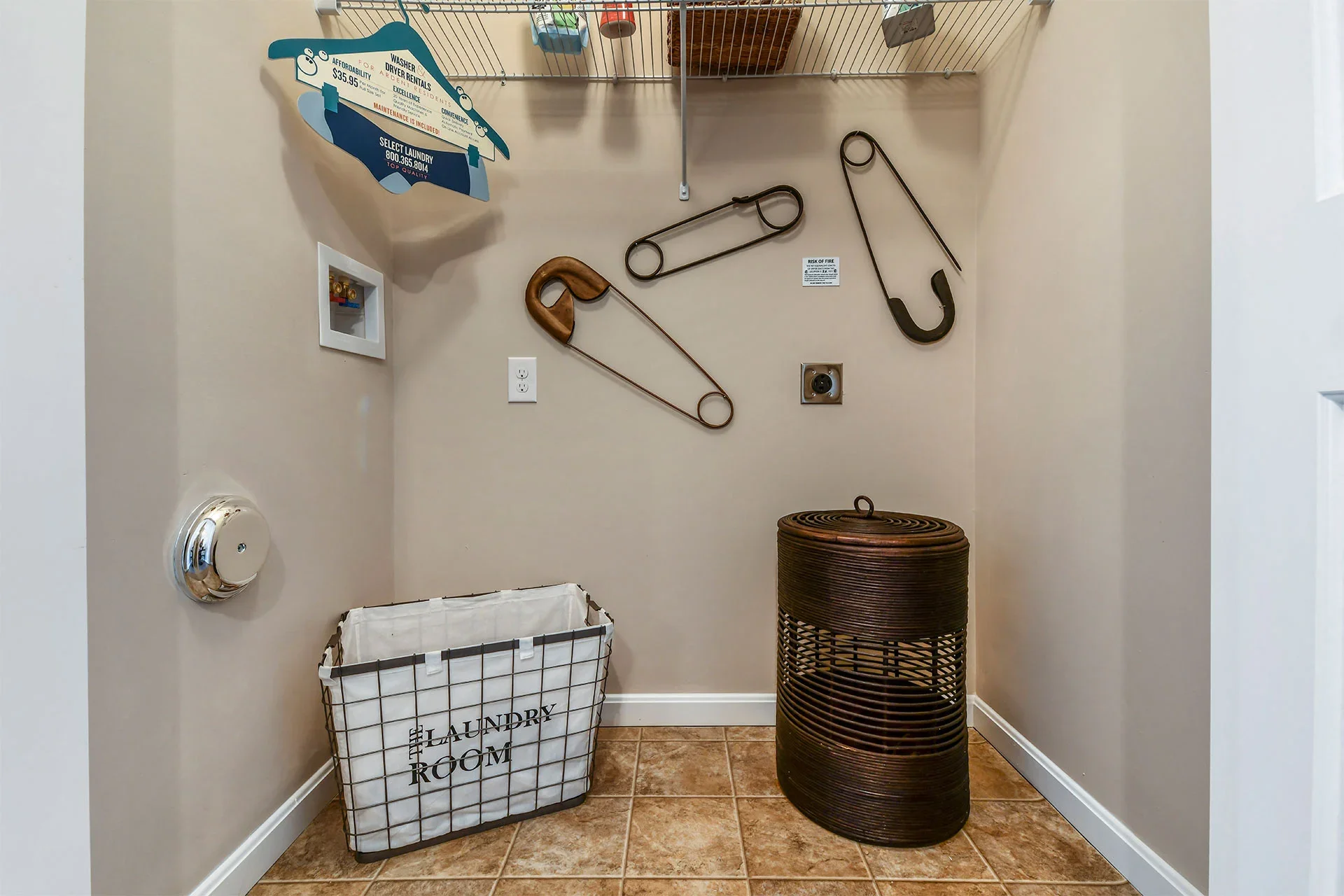 Laundry room with laundry basket, wire basket, laundry sign, wall-mounted clothes hooks, and a brown round laundry basket.