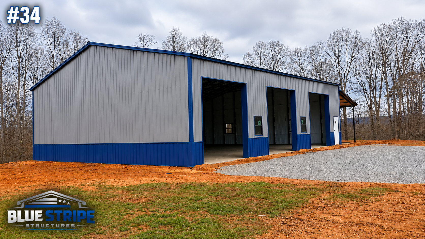 Large blue commercial workshop building with multiple service bays