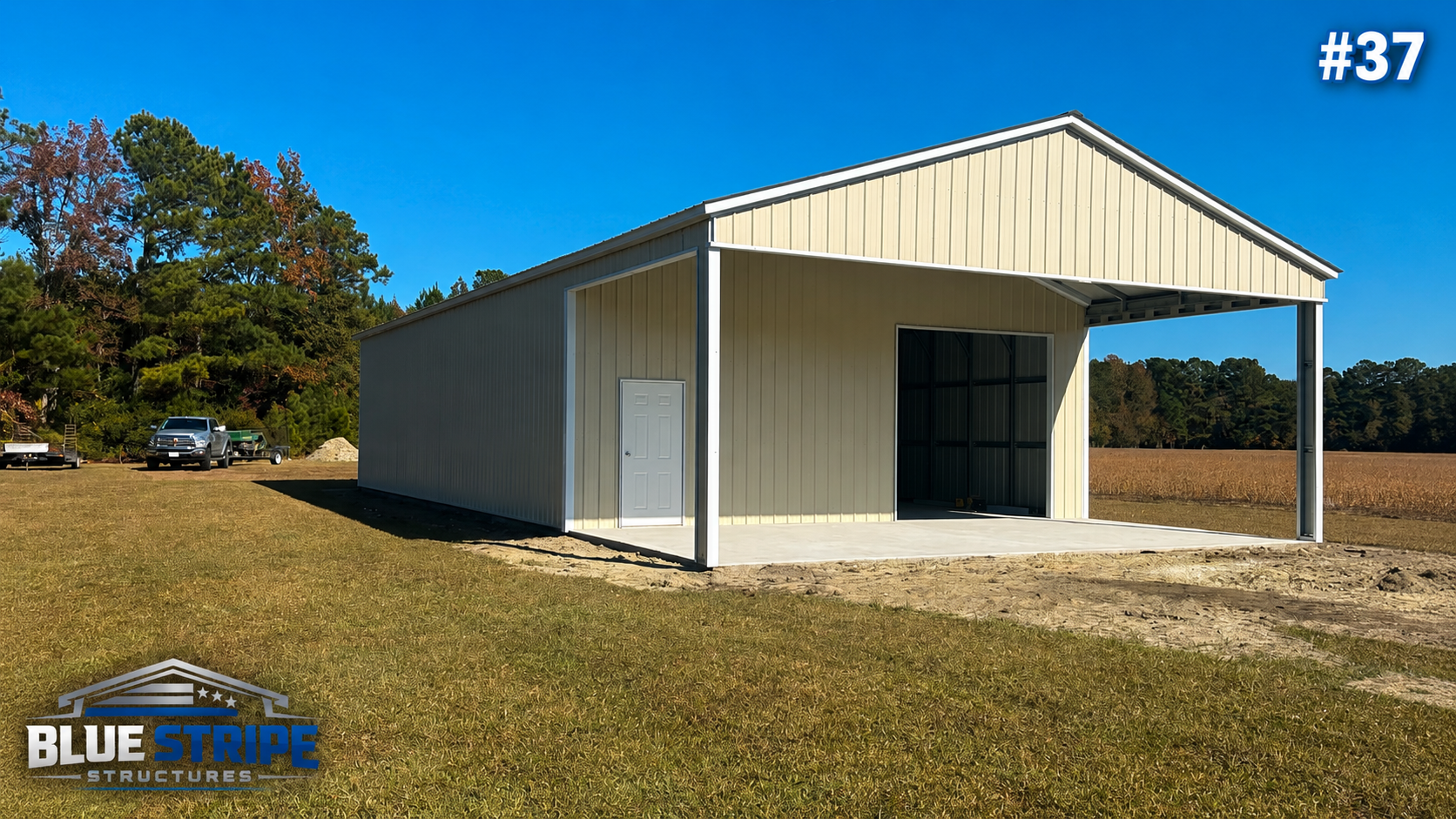Large beige workshop building with vertical metal siding