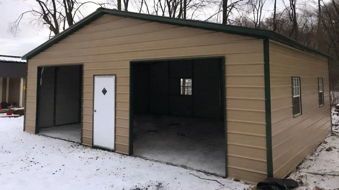 Wide two car garage with door and windows.