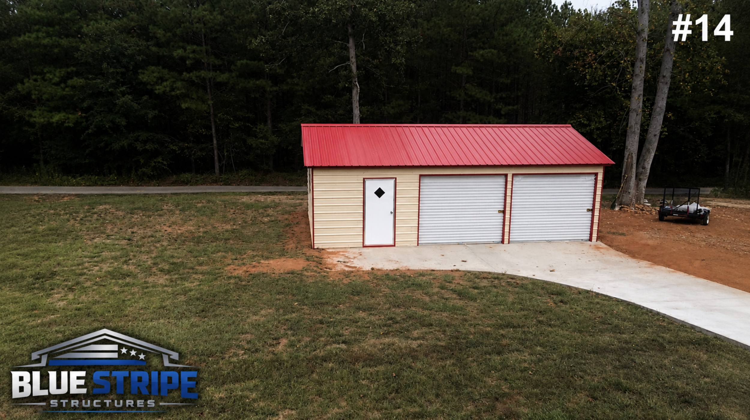 Residential metal garage with dual doors and red roof